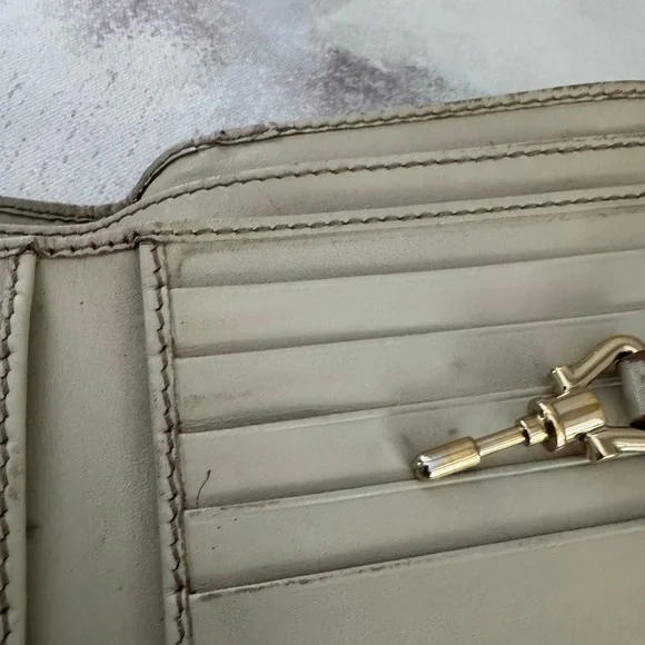 Gucci Guccissima Ivory Leather GG Logo BiFold Wallet, Gold Piston Closure